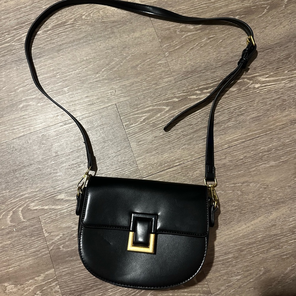 Chic Black Crossbody Bag with Gold Accent